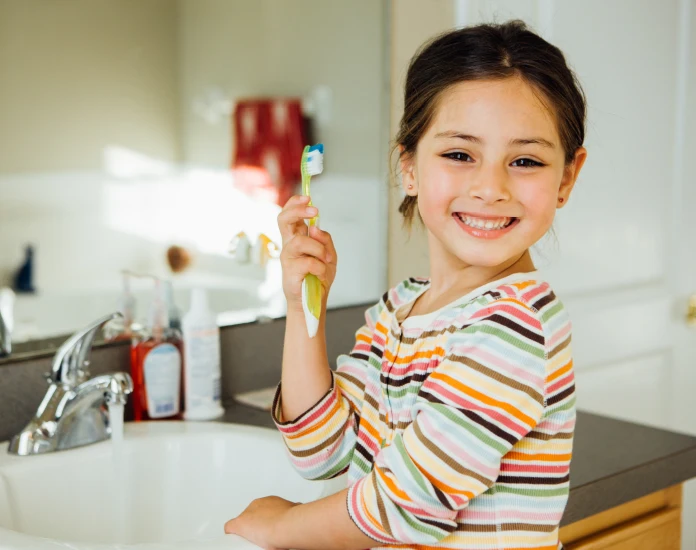 Girl with toothbrush